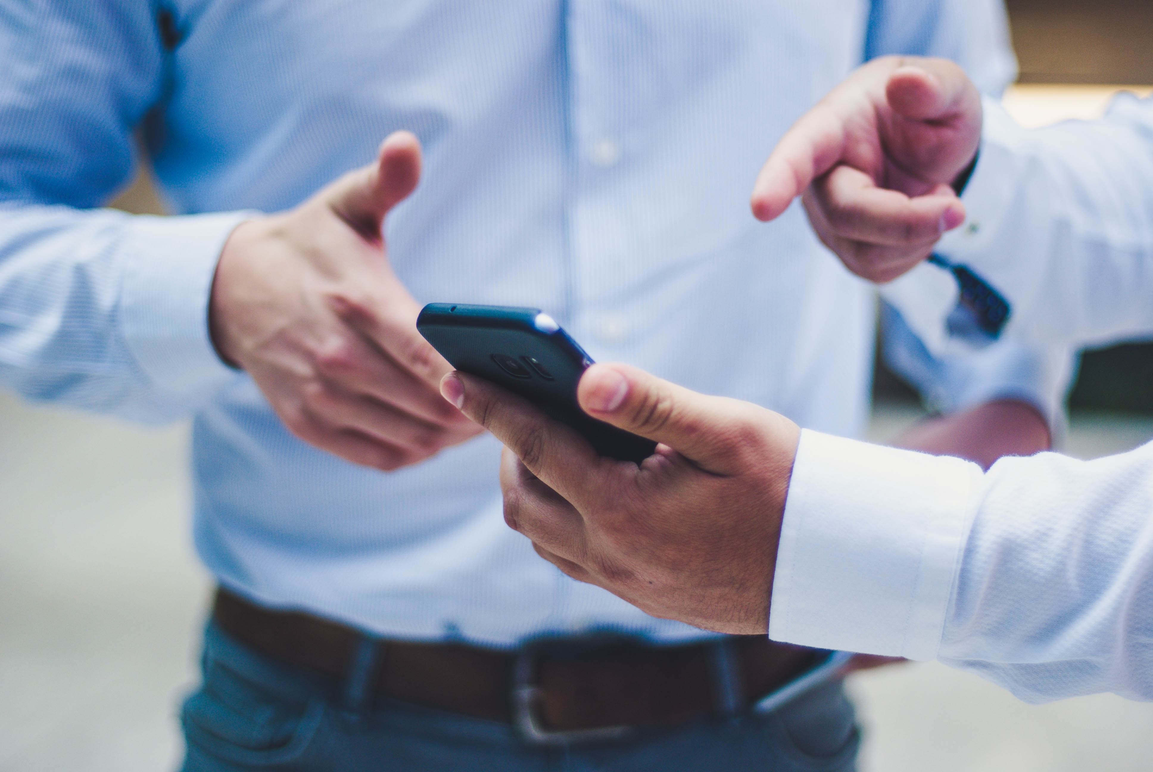 Men looking at mobile phone